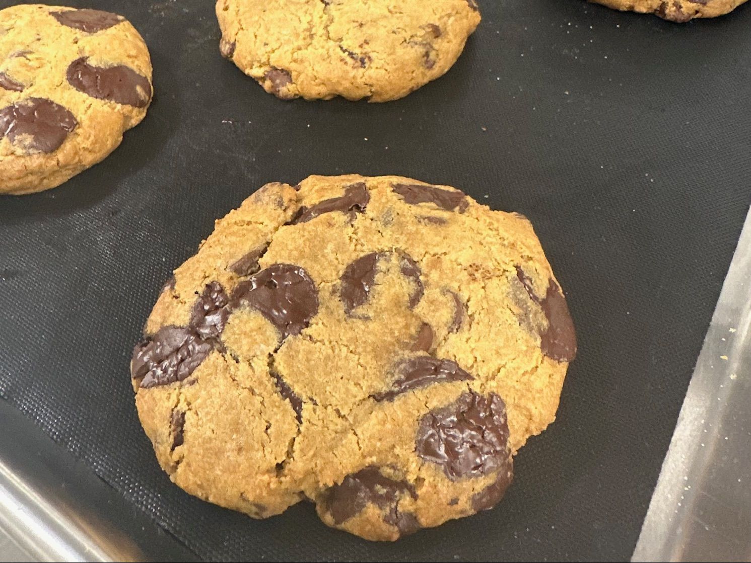 Chocolate chip cookies on a baking mat
